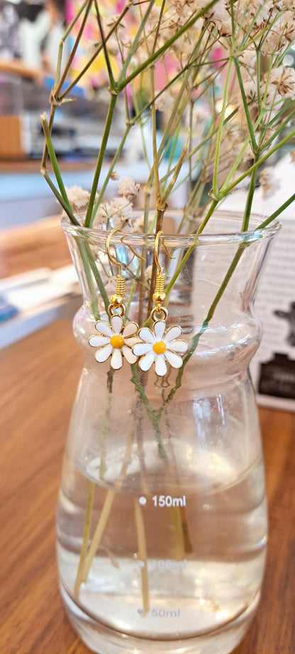 Handmade curved daisy flower earrings by Hoops and Clay